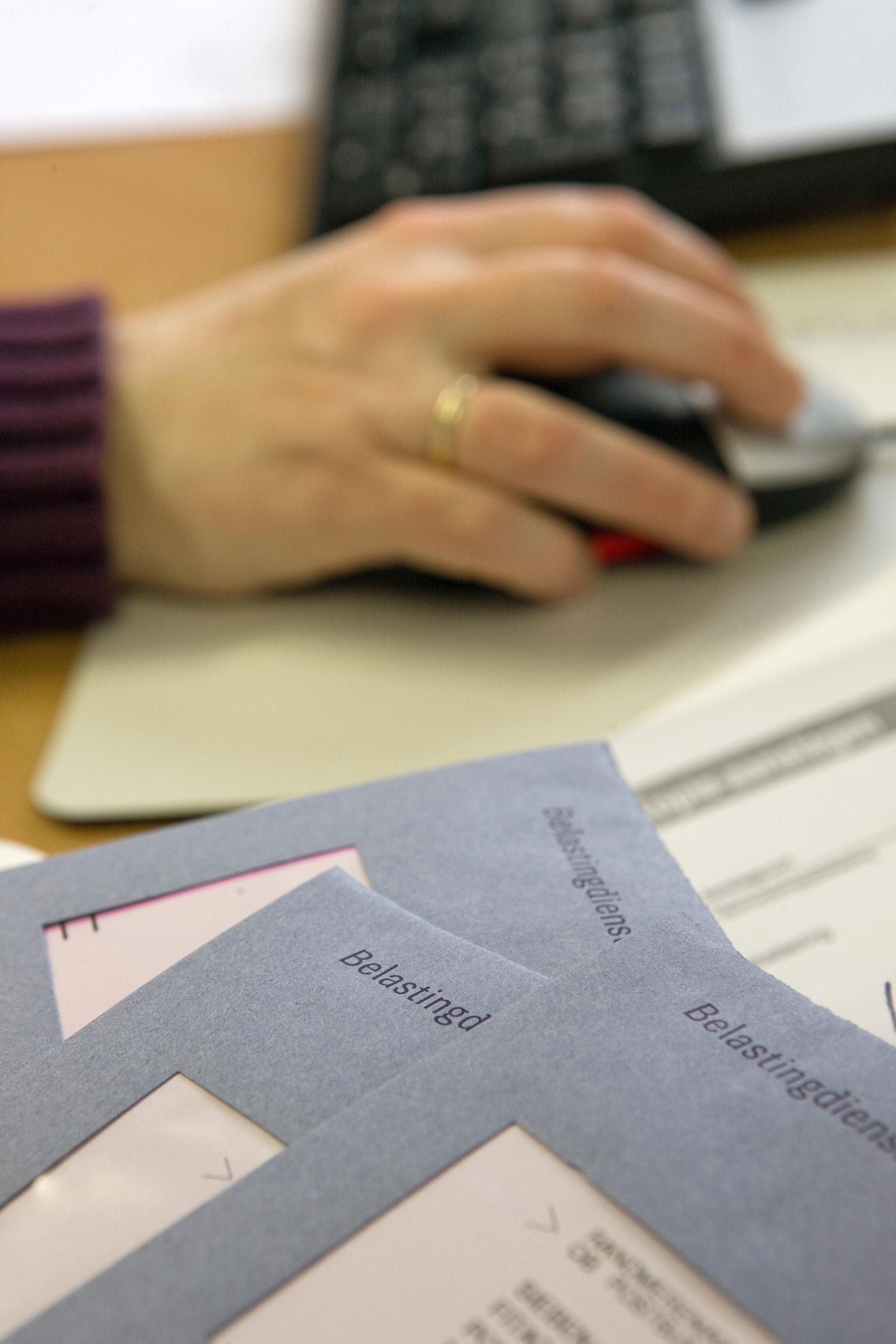 Dutch tax papers. Filling in tax papers. Paying taxes